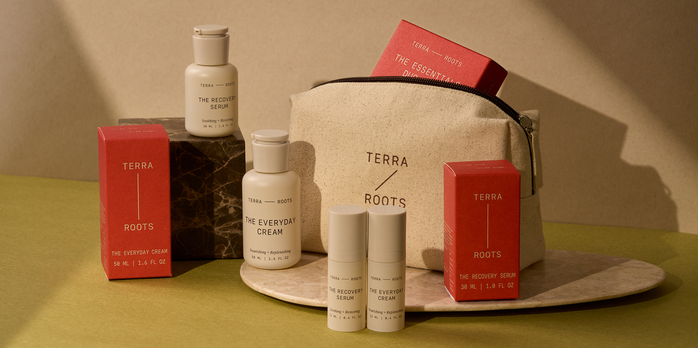 Terra Roots styled product group shot — pouches and bottles on natural surface